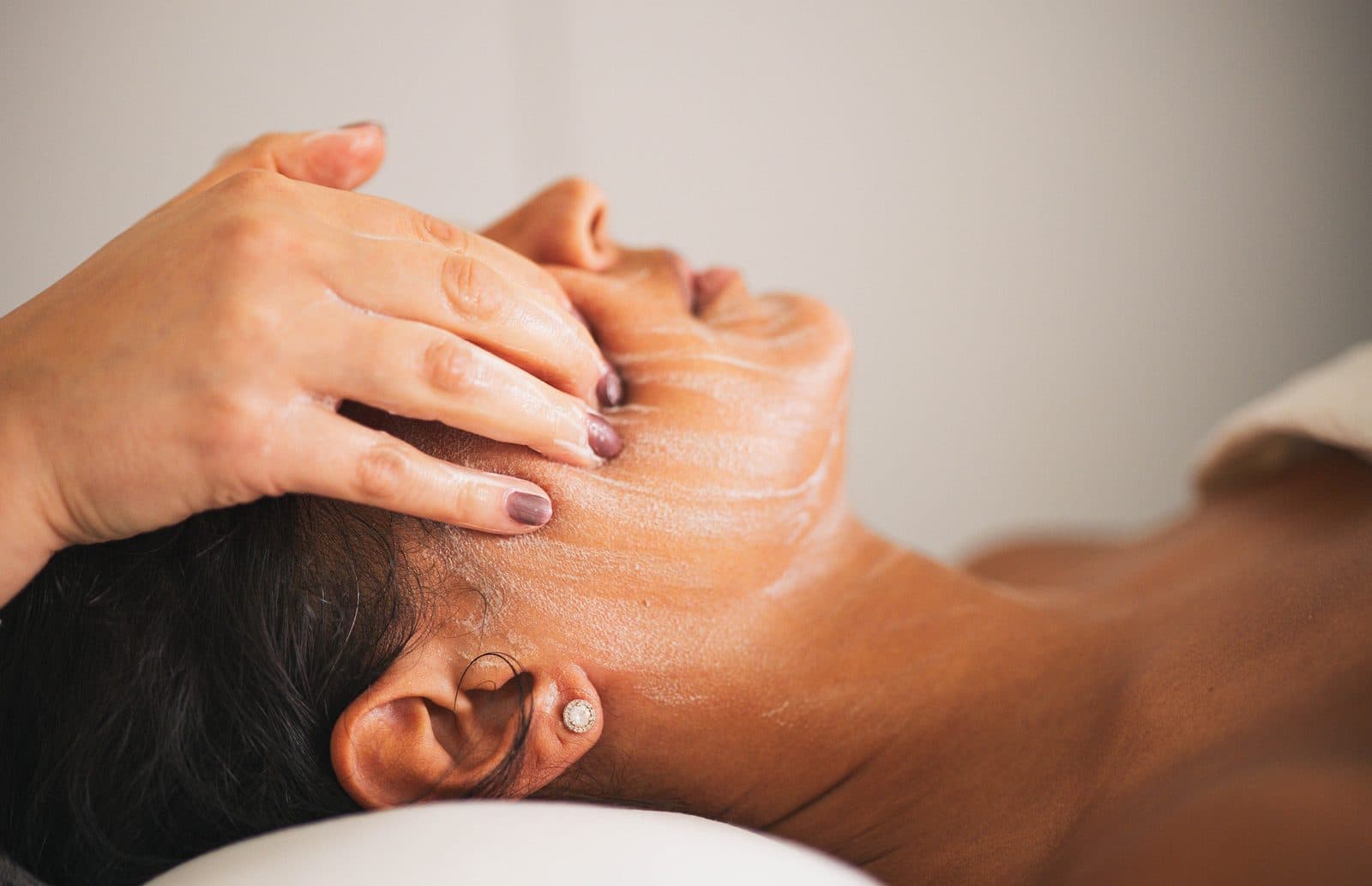 A slow, oil-based facial massage during the Signature Facial